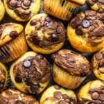 nutella muffins seen from the top with chocolate chips and nutella swirls.