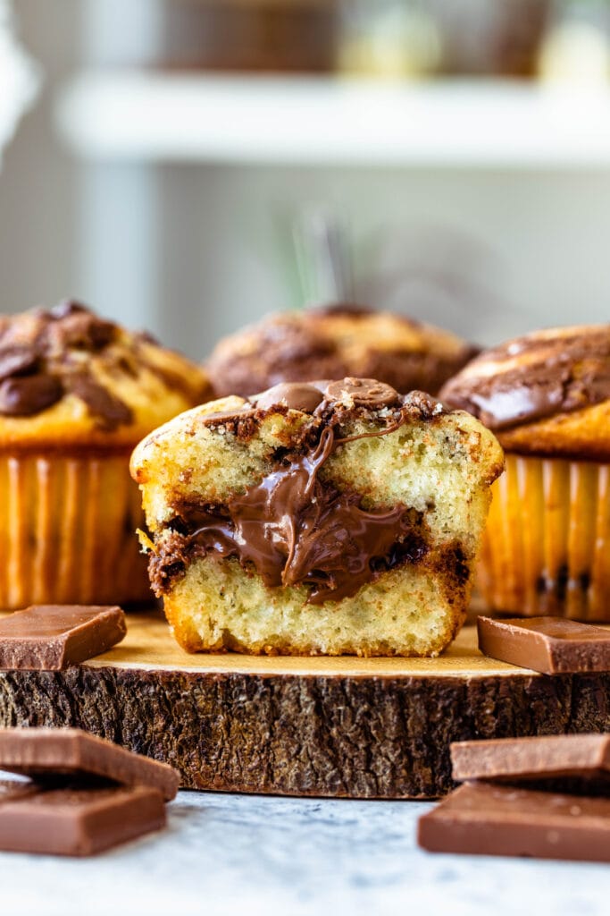 muffin sliced in half showing nutella filling.