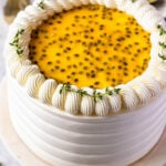 Passionfruit Cake frosted with Swiss meringue buttercream, topped with passionfruit seeds.