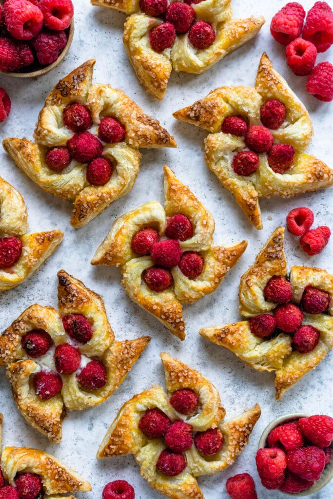 Puff Pastry pinwheels topped with raspberries.
