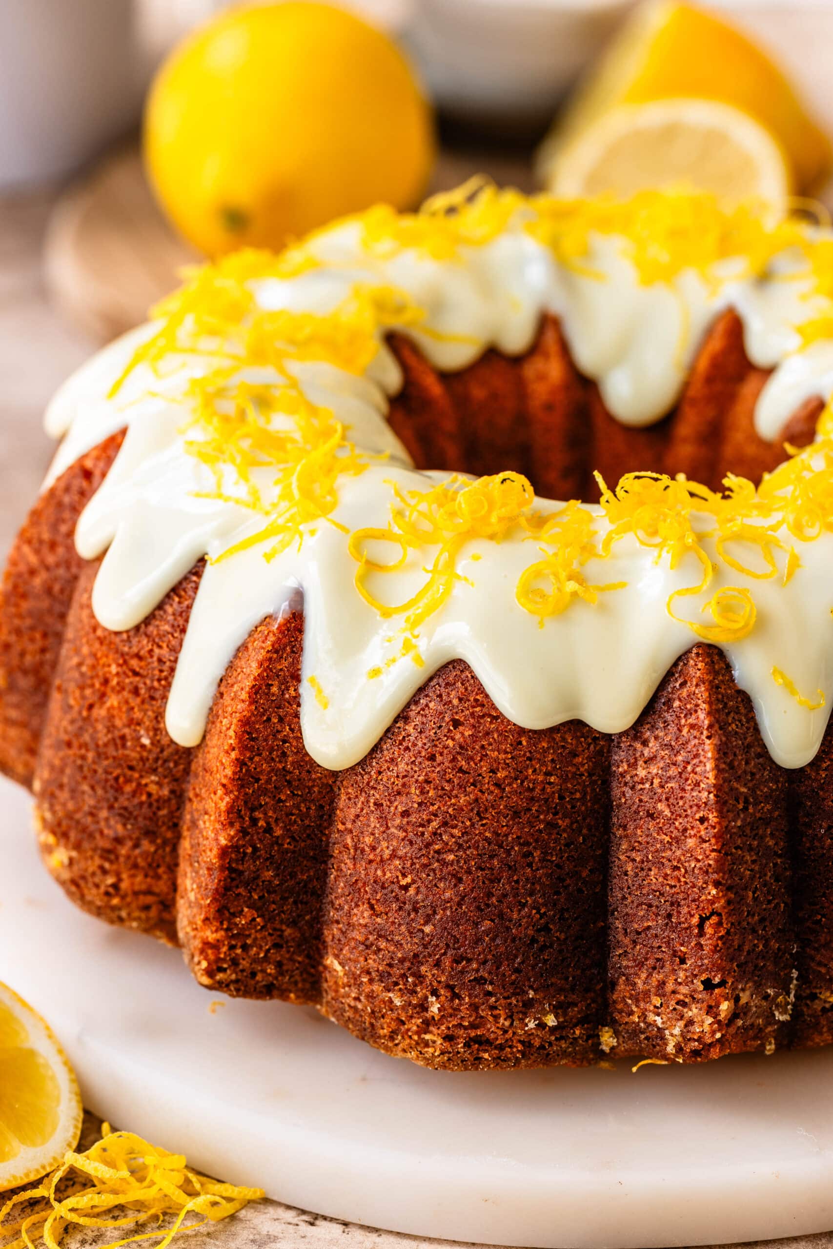 lemon bundt cake with a cream cheese glaze on top.