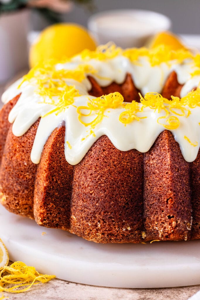 lemon pound cake with glaze drizzled over the top.