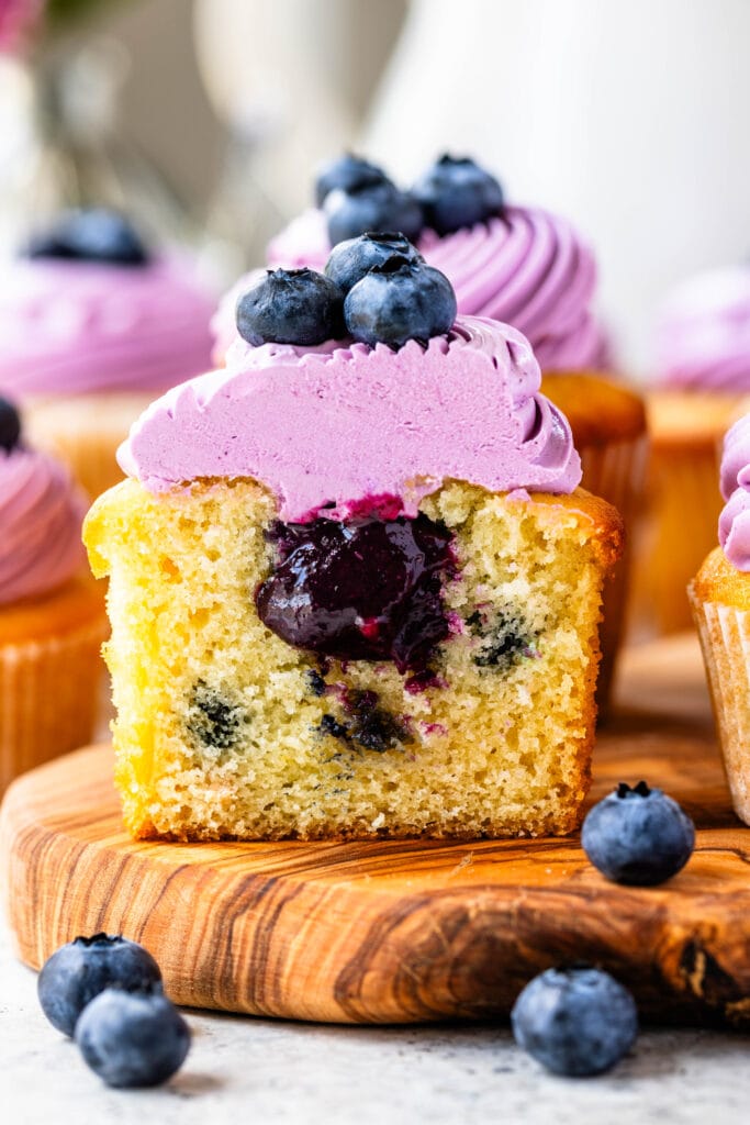 blueberry curd filled cupcakes sliced in half.