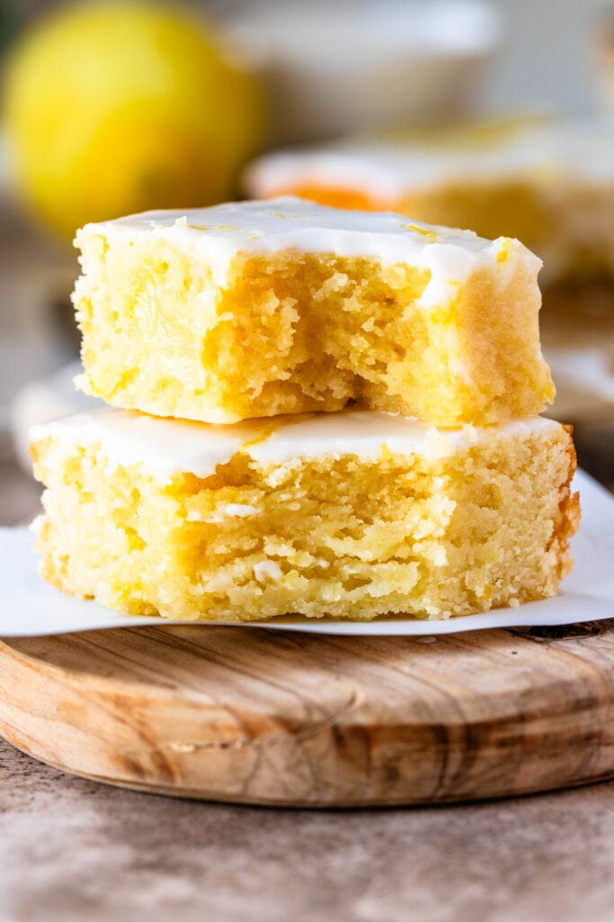 lemon brownies stacked on top of each other.