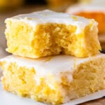 lemon brownies stacked on top of each other.