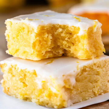 lemon brownies stacked on top of each other.