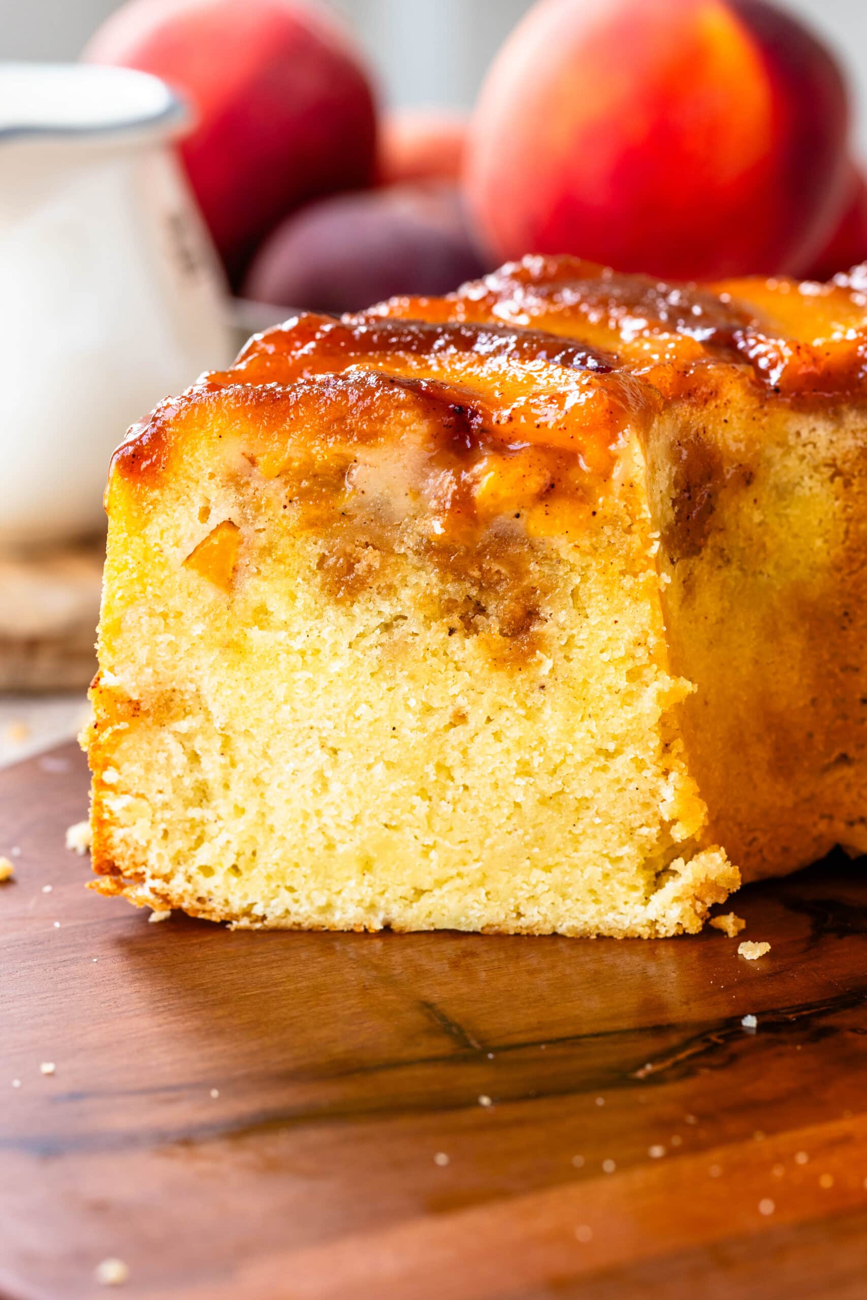 Peach Cobbler Pound Cake with peaches on top.