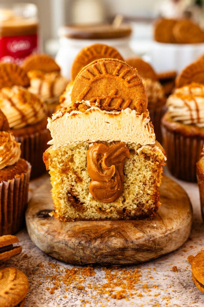 biscoff cupcake sliced in half showing biscoff filling inside.