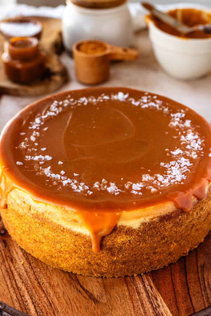 Salted Caramel Cheesecake with caramel sauce on top.