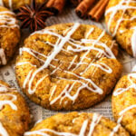 Pumpkin Cookies with glaze on top, cinnamon sticks around.