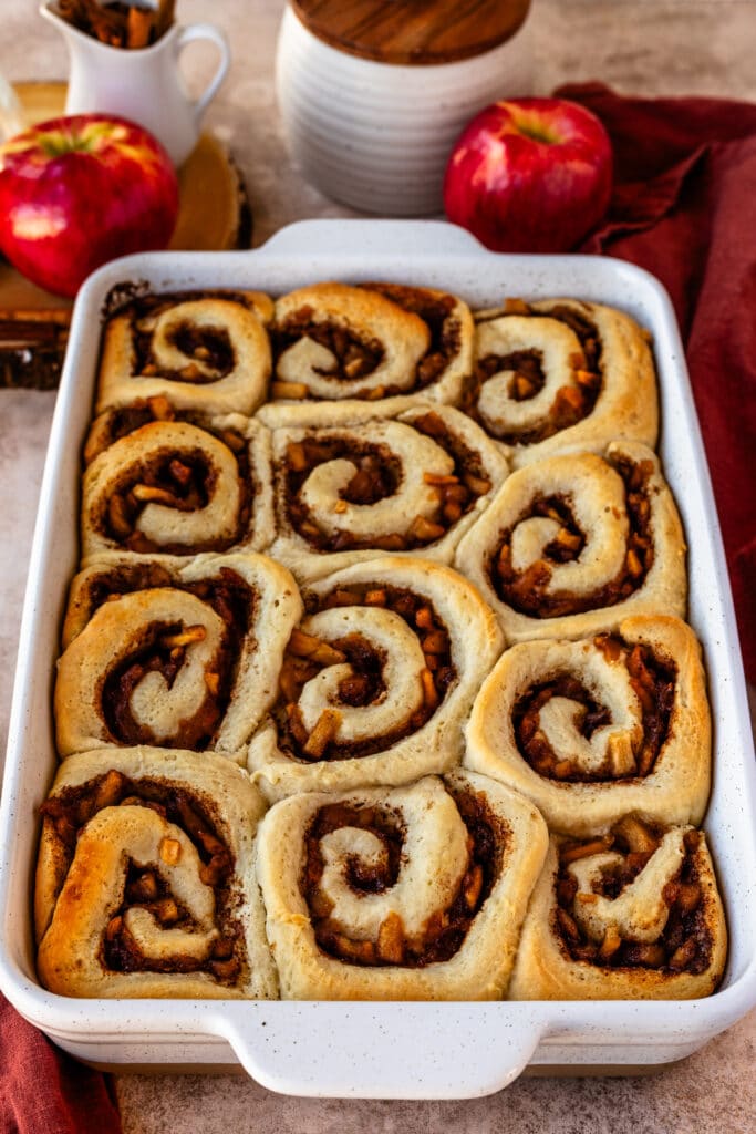 apple cinnamon rolls in a baking pan.