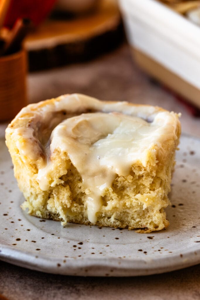 apple pie cinnamon roll with glaze on top.