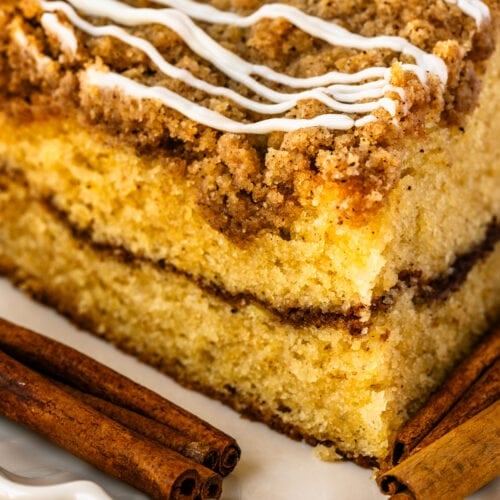 coffee cake slice with cinnamon filling, and crumb on top.