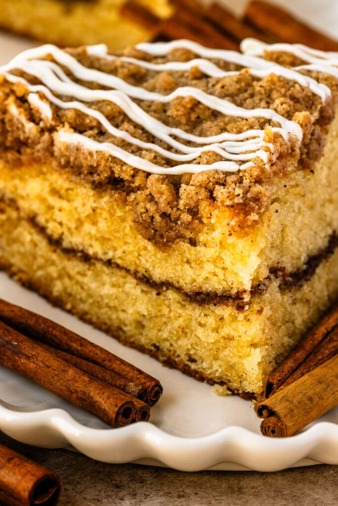 coffee cake slice with cinnamon filling, and crumb on top.