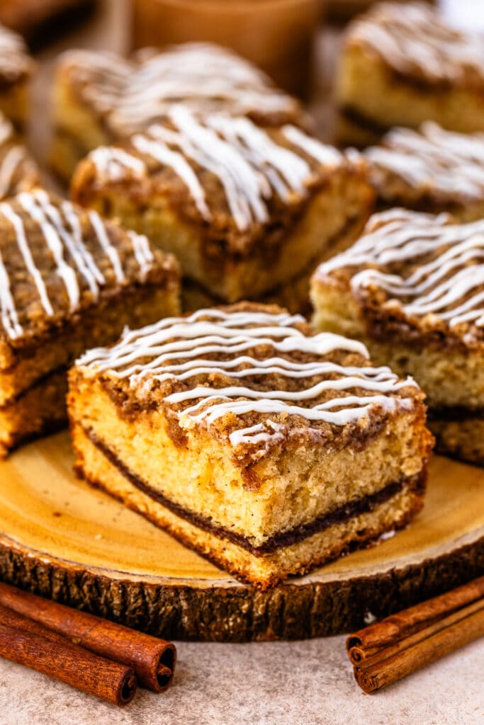 coffee cake slice with cinnamon filling, and crumb on top.