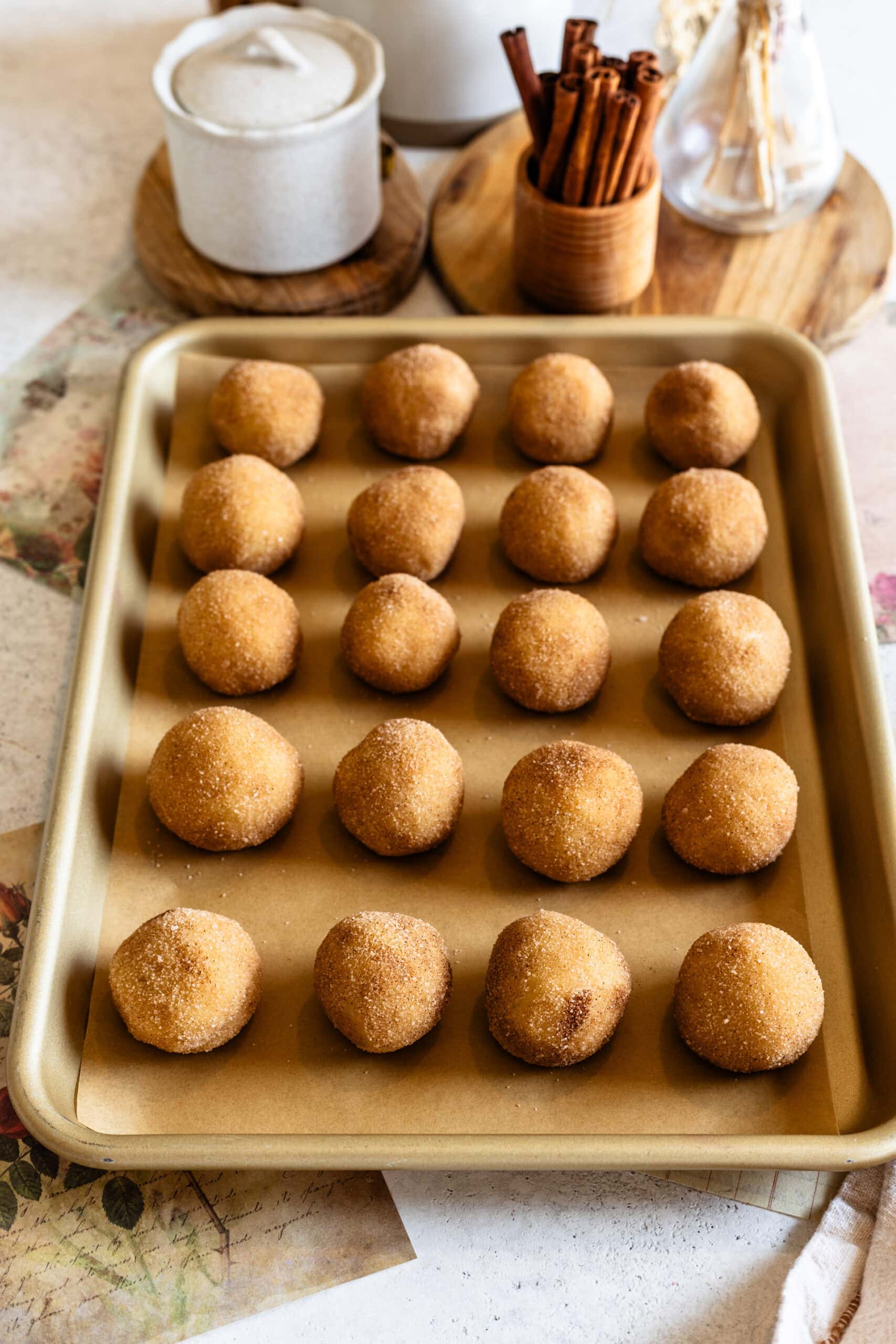 snickerdoodle cookies placed on top of a baking tray.