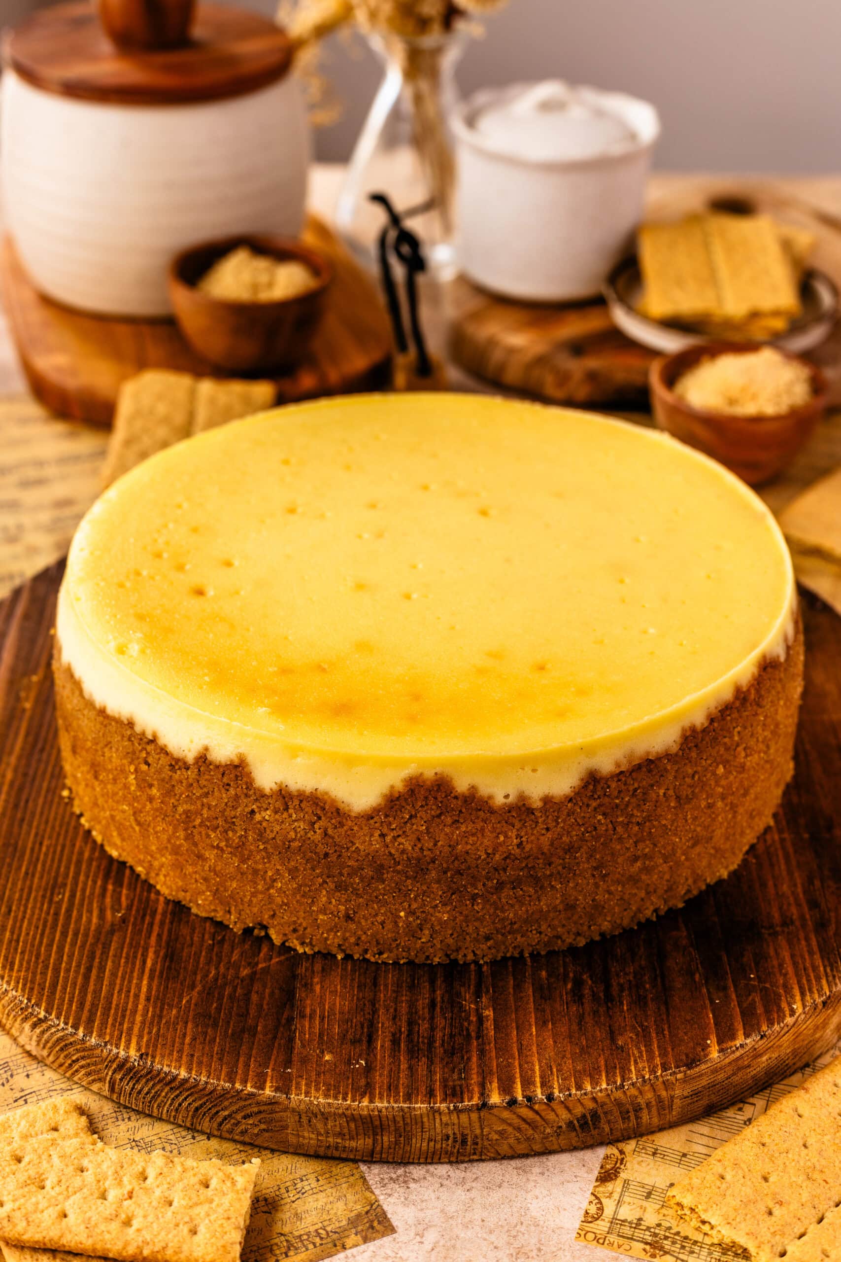 new york cheesecake on top of a wooden board.