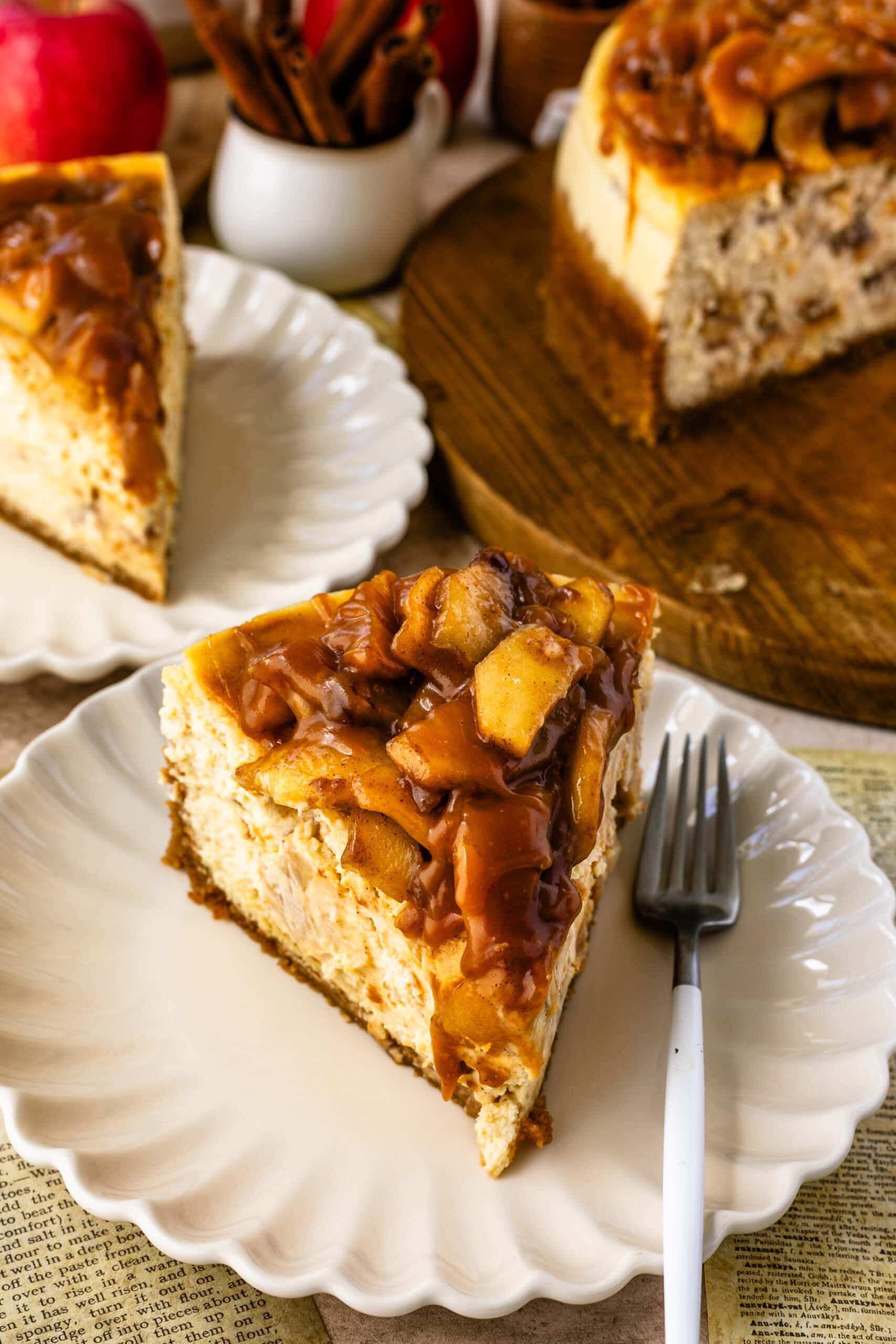 Caramel apple cheesecake slice on a plate.