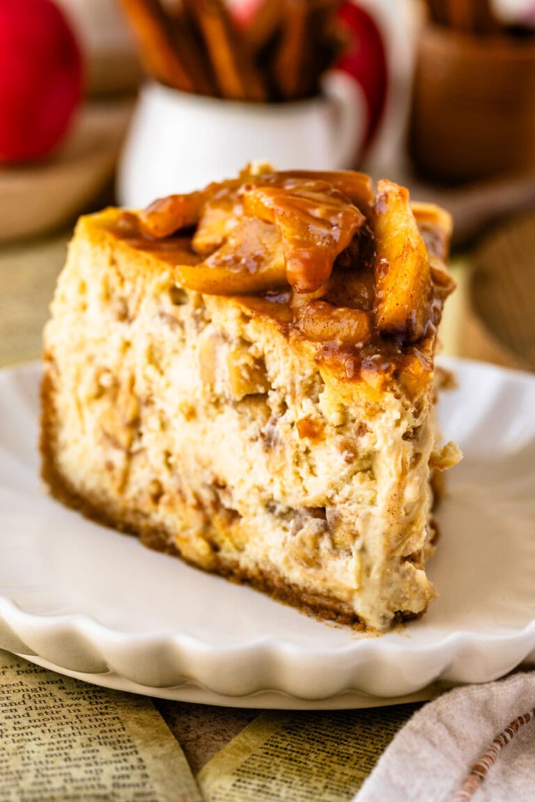 Caramel apple cheesecake slice on a plate.