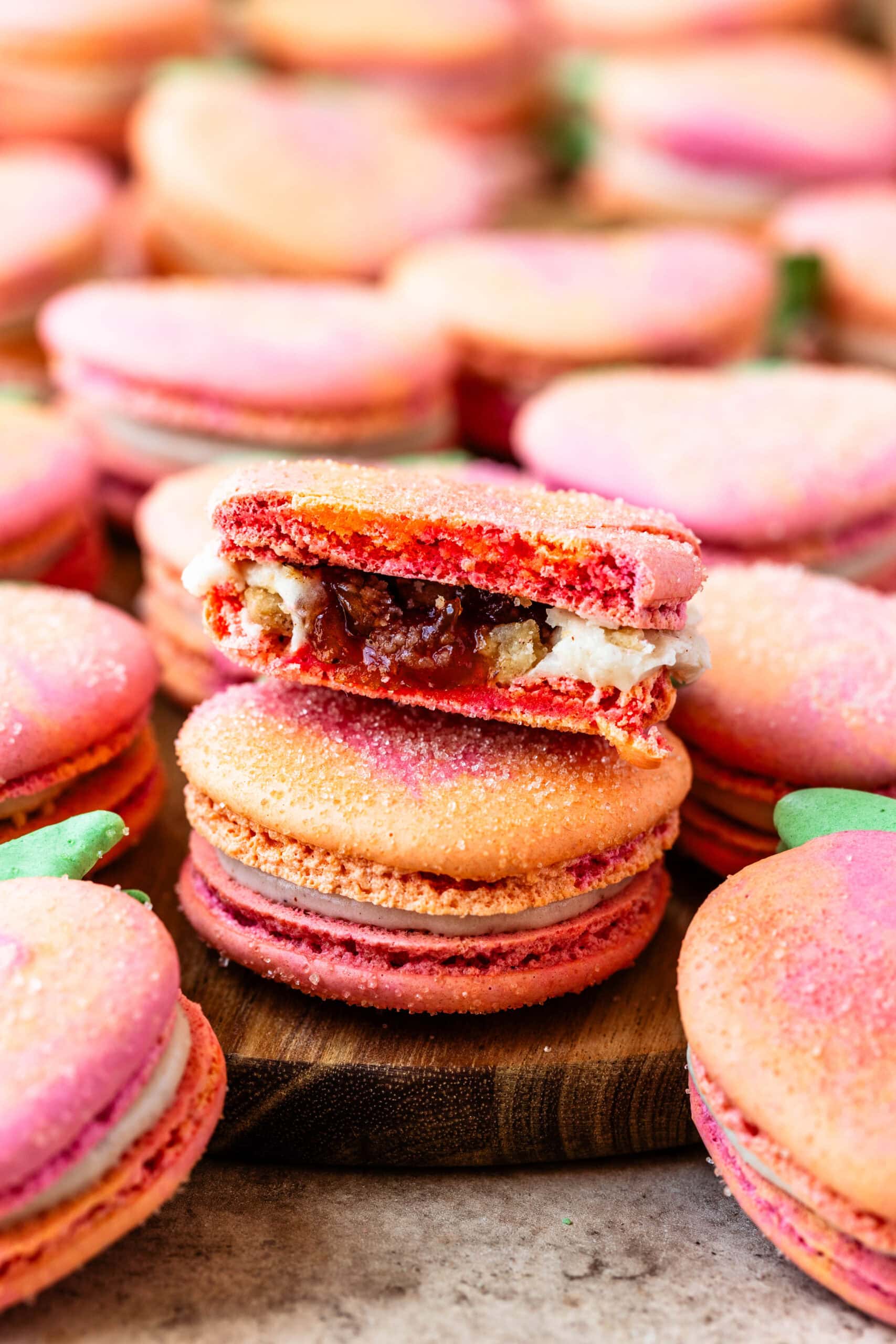 peach macarons sliced in half showing peach filling.