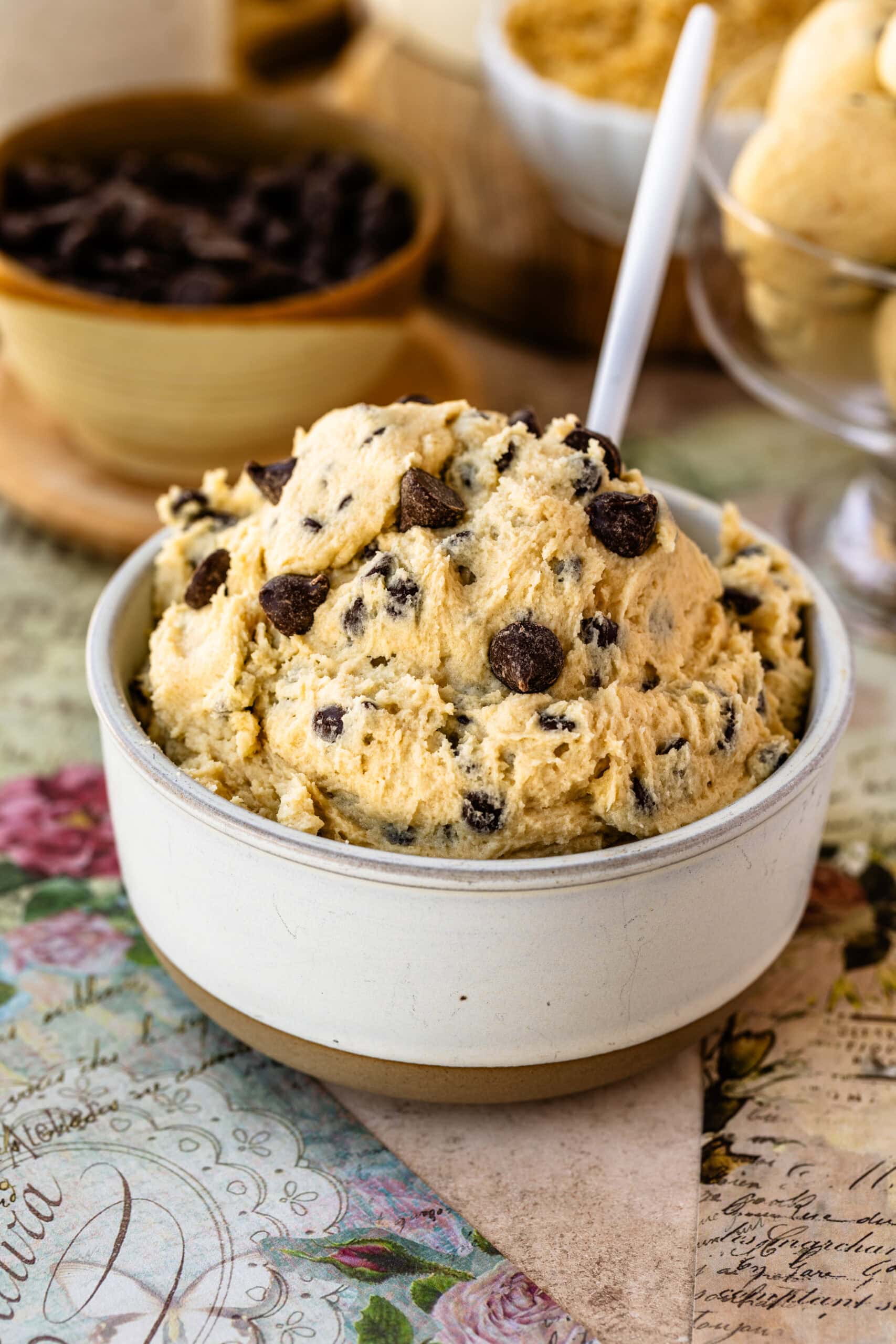 A bowl of rich and creamy edible cookie dough filled with chocolate chips, ready for indulgent and safe snacking.