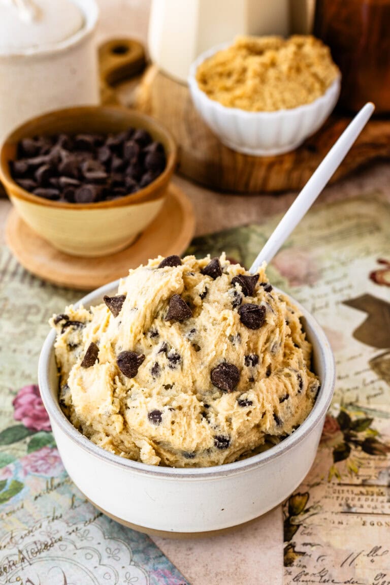 A bowl of rich and creamy edible cookie dough filled with chocolate chips, ready for indulgent and safe snacking.