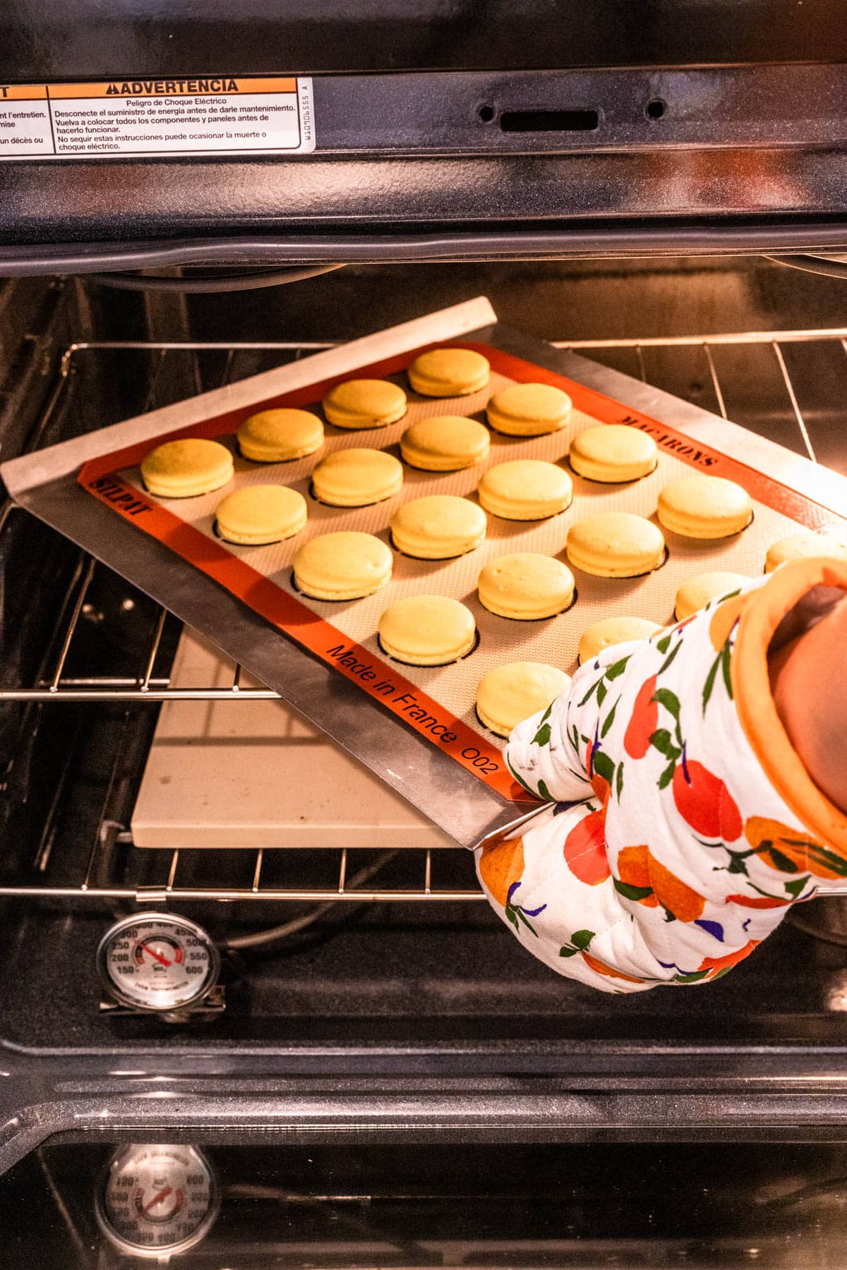 rotating macarons in the oven.