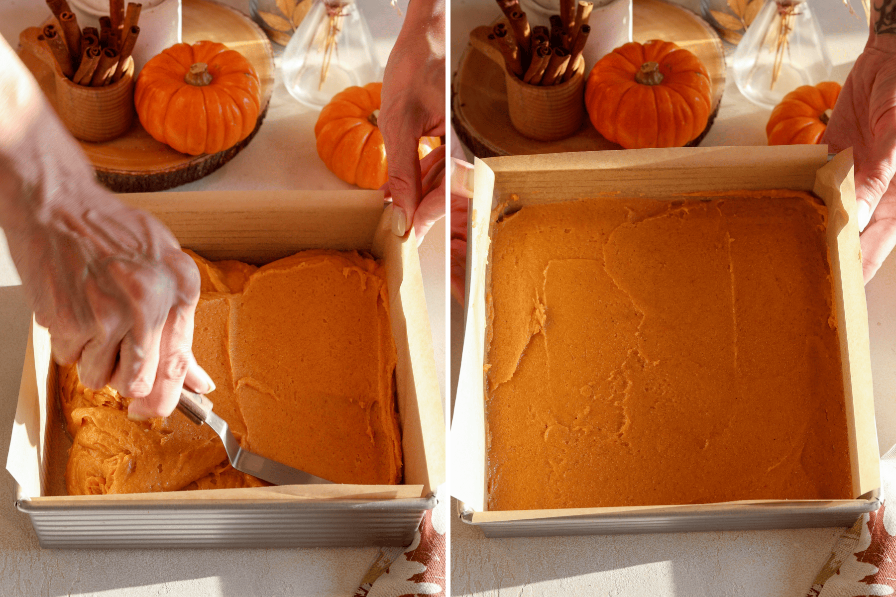 Two images showing the preparation of pumpkin blondie batter: The first image captures the batter being spread evenly in a parchment-lined square baking pan using an offset spatula, surrounded by small pumpkins and cinnamon sticks for a warm, autumnal feel. The second image displays the batter smoothed out in the pan, ready for baking, with a soft glow highlighting the rich orange color and festive background decor.
