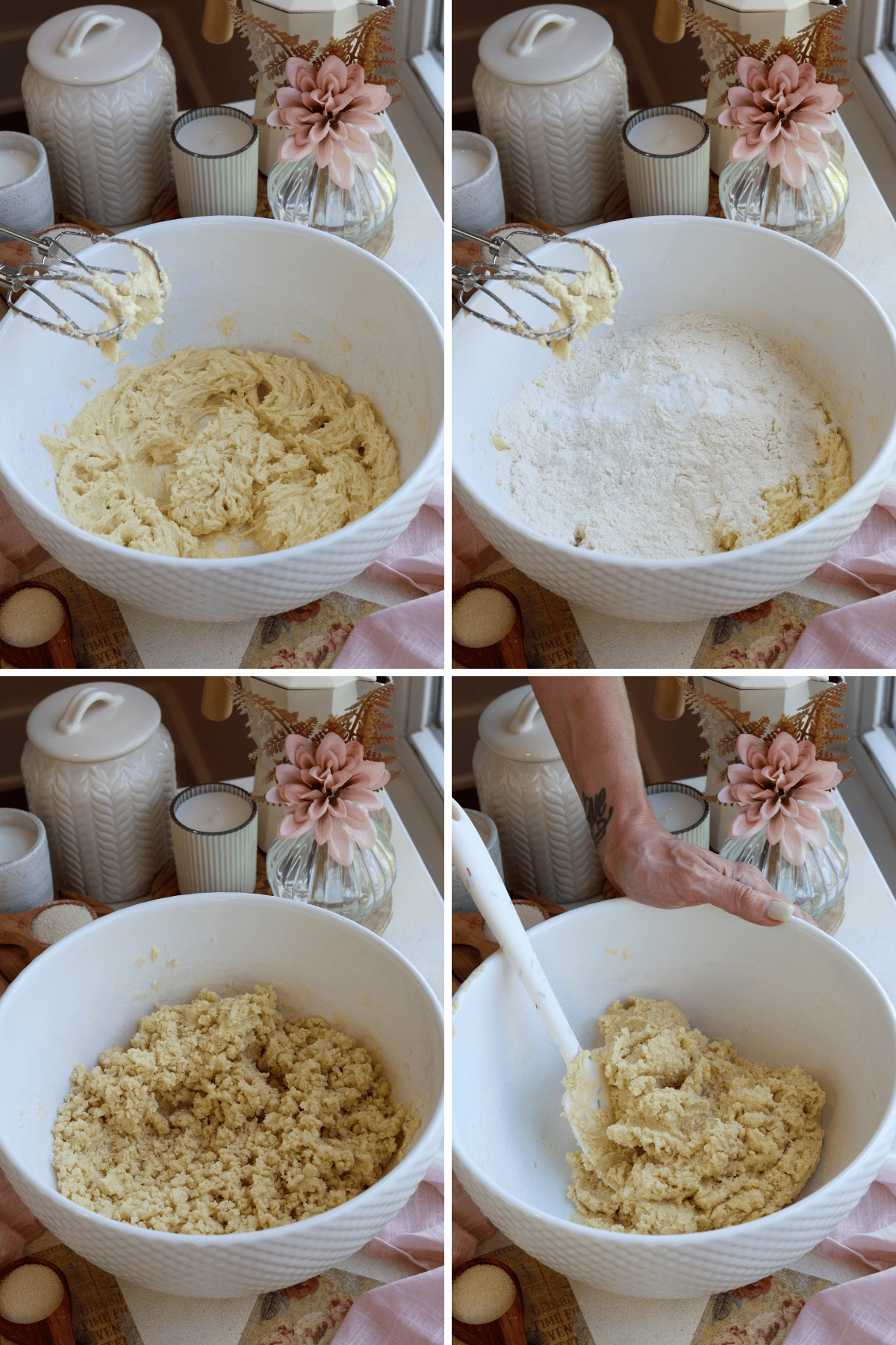Panel with 4 images showing the next steps in making sugar cookies. The first image shows the creamed mixture of butter, sugar, eggs, and vanilla, which has a smooth consistency. The second image depicts the addition of dry ingredients, such as flour, baking powder, and salt, to the bowl. The third image shows the dough beginning to come together after mixing the dry and wet ingredients. The fourth image features a hand holding the bowl steady while a spatula is used to fold and incorporate the remaining dry ingredients, forming a soft cookie dough. The background remains decorated with a pink flower, candles, and jars, creating a warm and inviting baking atmosphere.