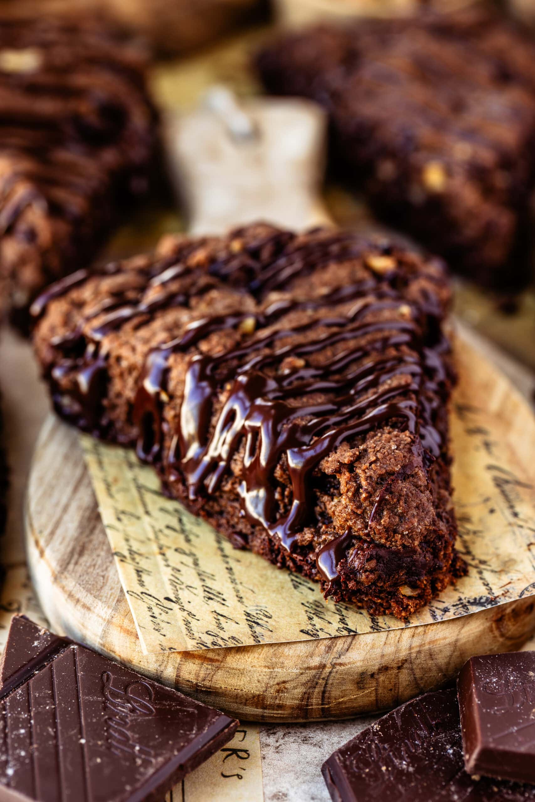 A freshly baked espresso chocolate scone drizzled with a silky chocolate ganache.
