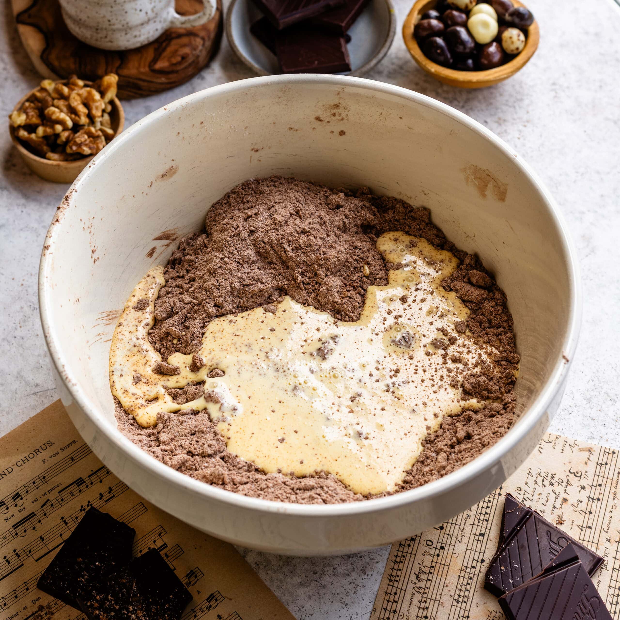 Wet ingredients being added to the dry ingredients of delicious espresso chocolate scones.