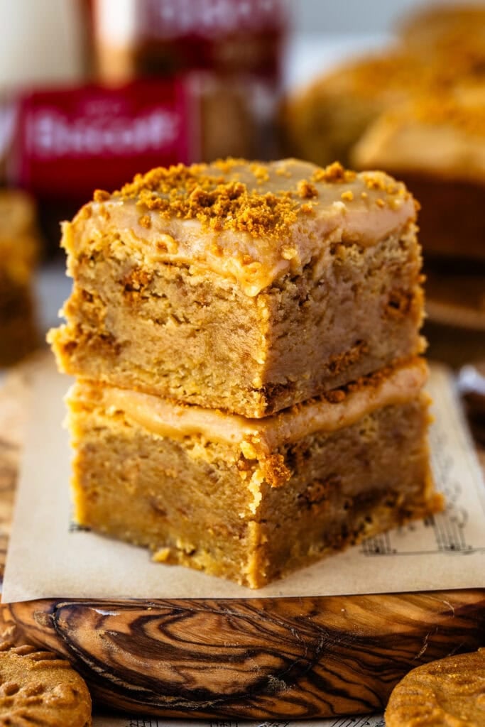 Two freshly baked Biscoff blondies stacked on top of each other with a silky Biscoff ganache.