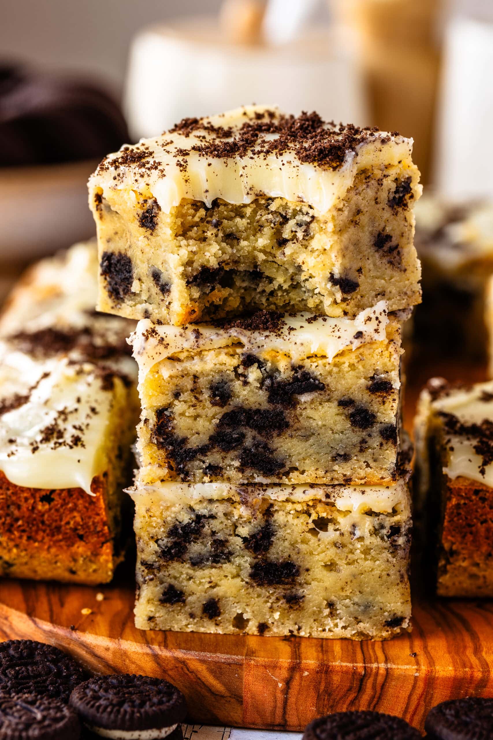 Three stacked Cookies and Cream Blondies with a dense gooey center.