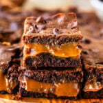 Two stacked Dulce de Leche Brownies showing their gooey and chocolatey interior.