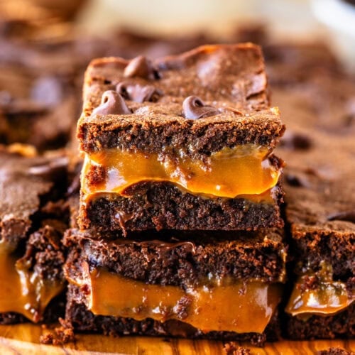 Two stacked Dulce de Leche Brownies showing their gooey and chocolatey interior.