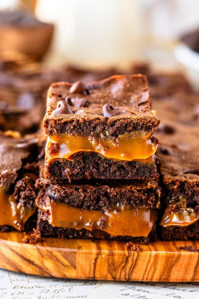 Two stacked Dulce de Leche Brownies showing their gooey and chocolatey interior.