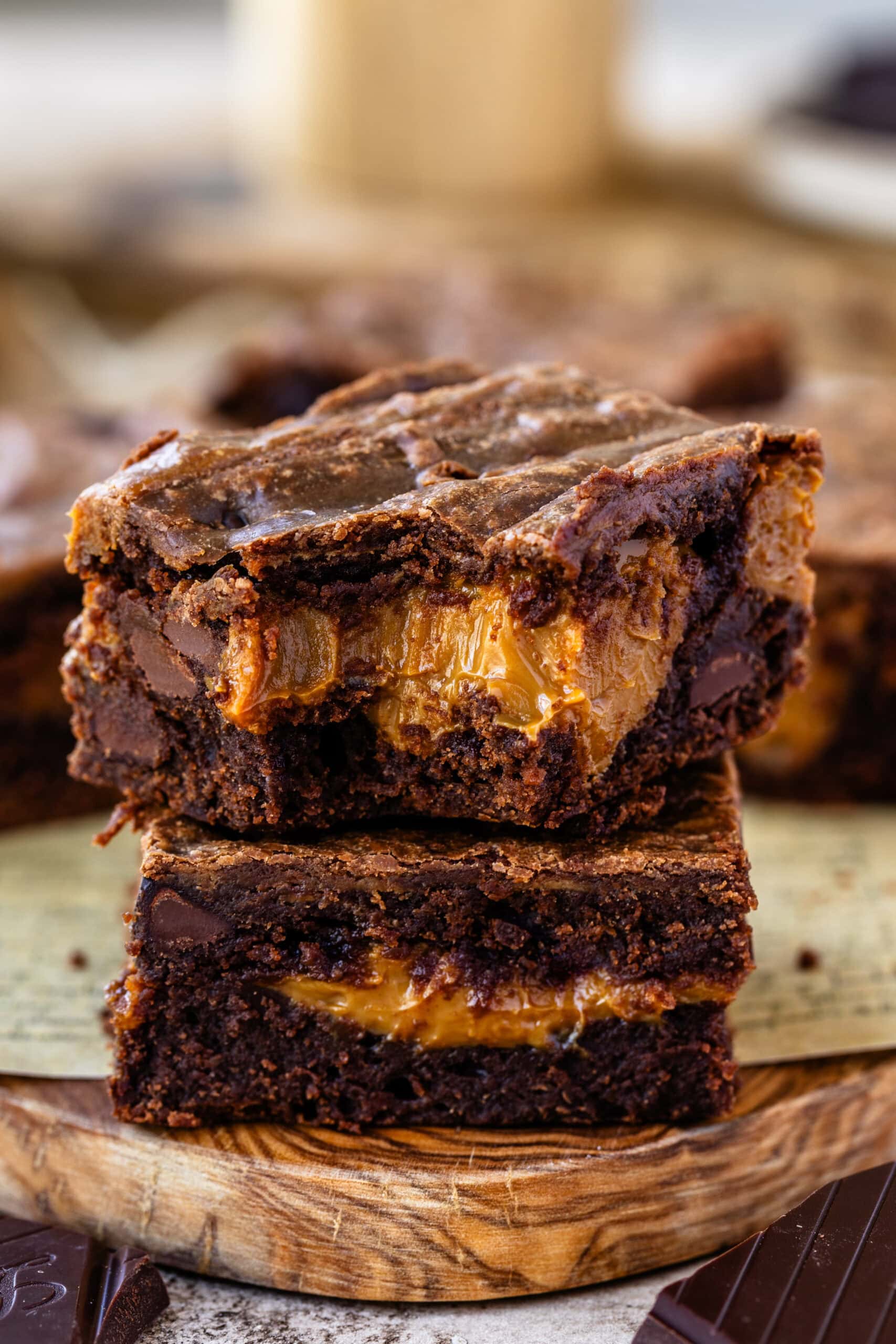 Two stacked Dulce de Leche Brownies showing their gooey and chocolatey interior.