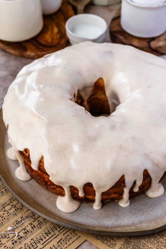 The glazed donut cake covered in a thick vanilla glaze that drips down the sides like a classic bakery-style glazed donut.