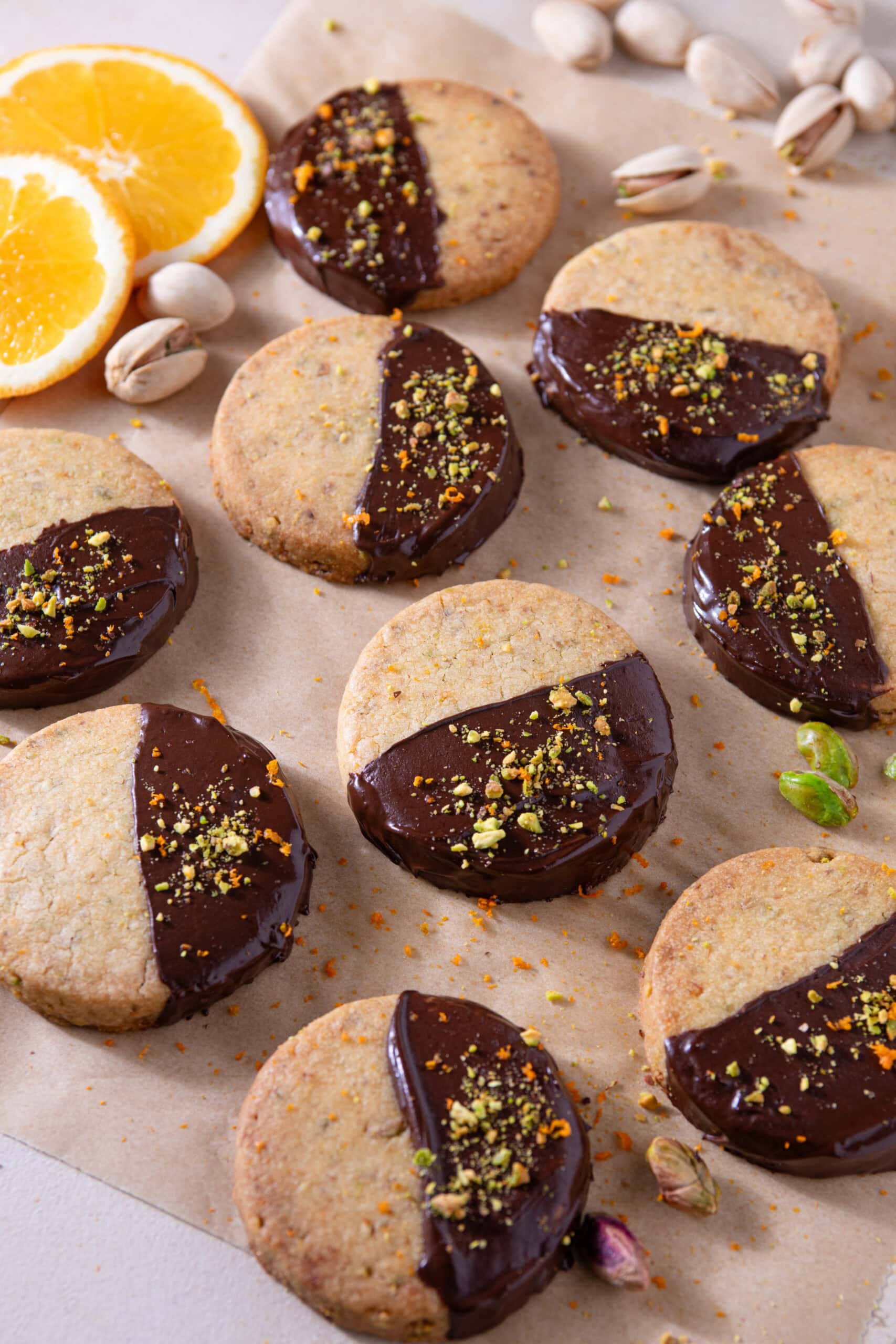 Chocolate dipped orange pistachio shortbread cookies served with tea
