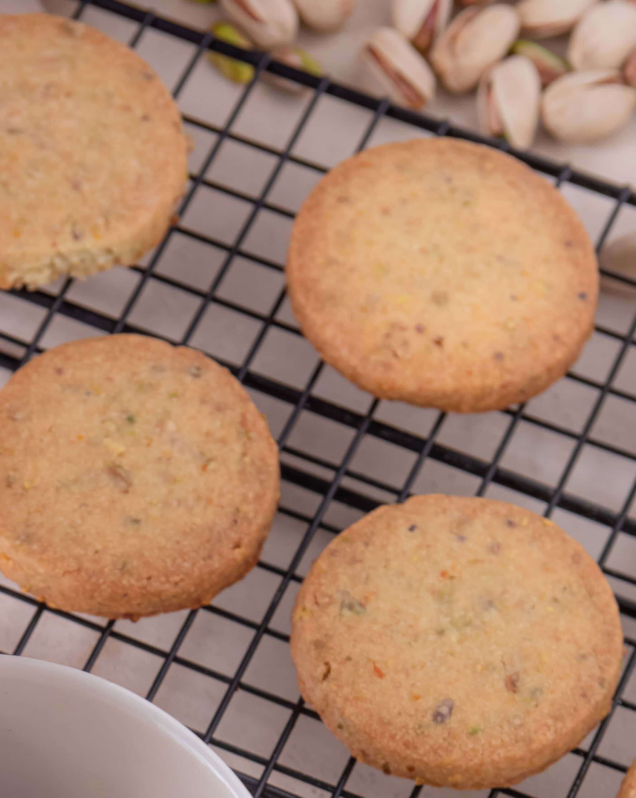 Freshly baked cornbread muffins on a cooling rack for tacos and pies.