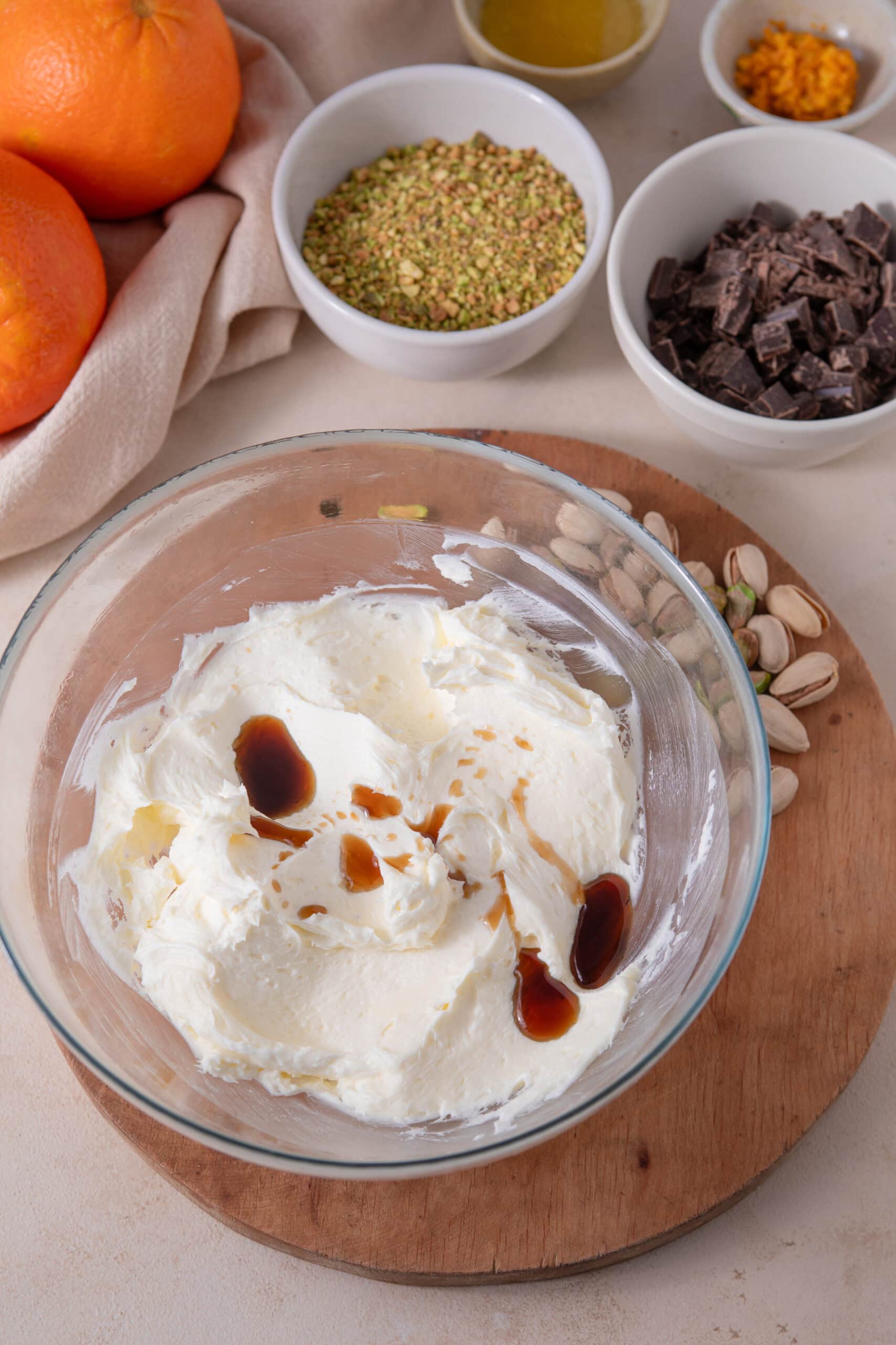 Adding vanilla extract to the butter mixture for orange pistachio shortbread cookies
