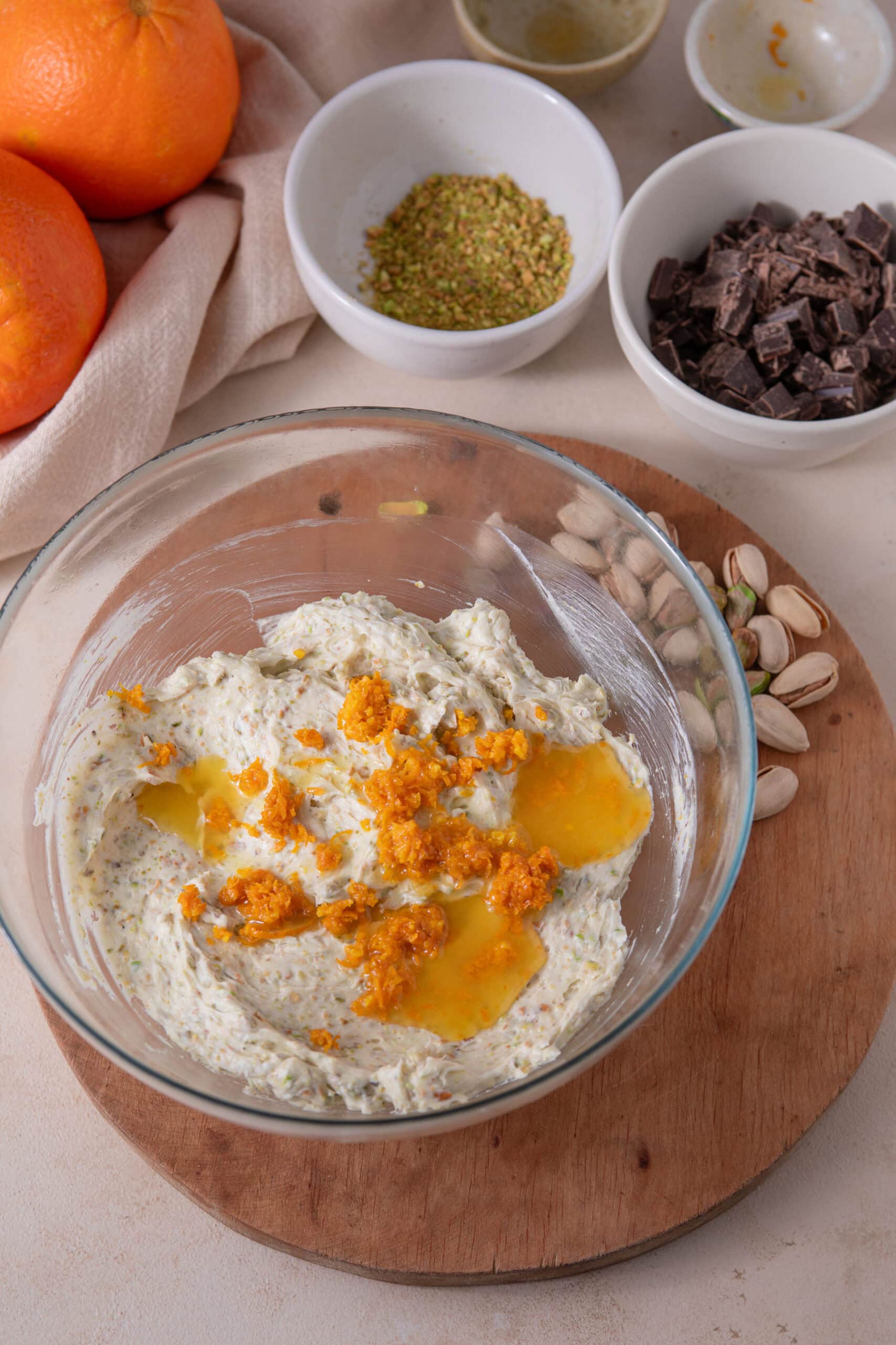 Orange zest and orange juice added to orange pistachio shortbread cookie dough