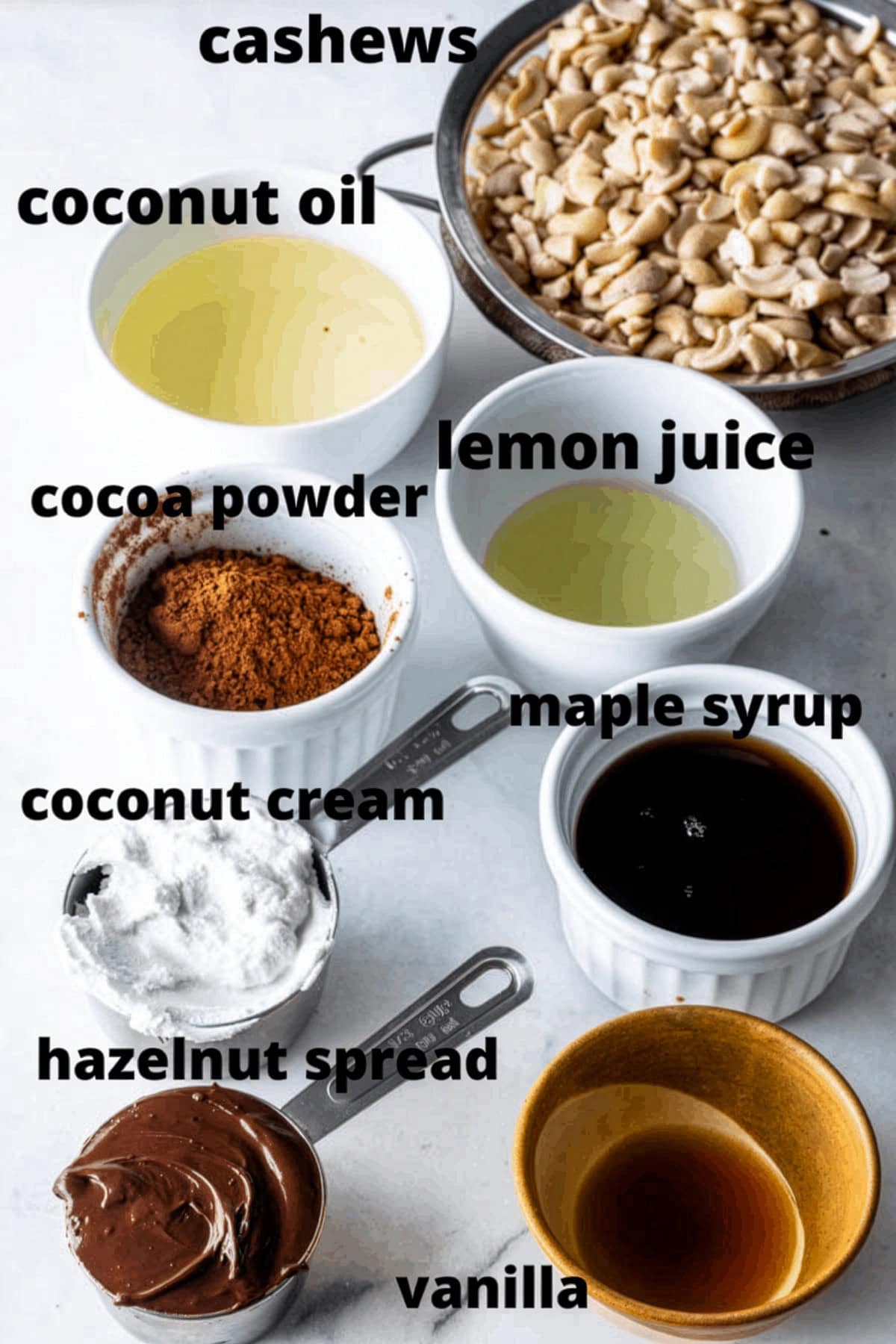 Cashews, coconut oil, lemon juice, cocoa powder, maple syrup, coconut cream, hazelnut spread, and vanilla for the cheesecake filling.