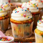 Homemade Funfetti Cupcakes with cream cheese buttercream frosting and rainbow jimmies sprinkles.