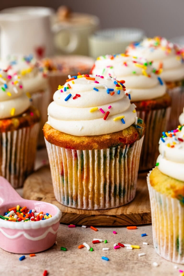 Homemade Funfetti Cupcakes with cream cheese buttercream frosting and rainbow jimmies sprinkles.