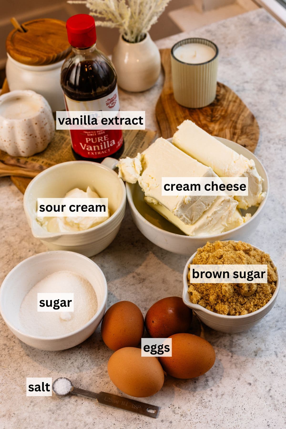 Labeled ingredient photos for blueberry crumble cheesecake bars on a granite surface.