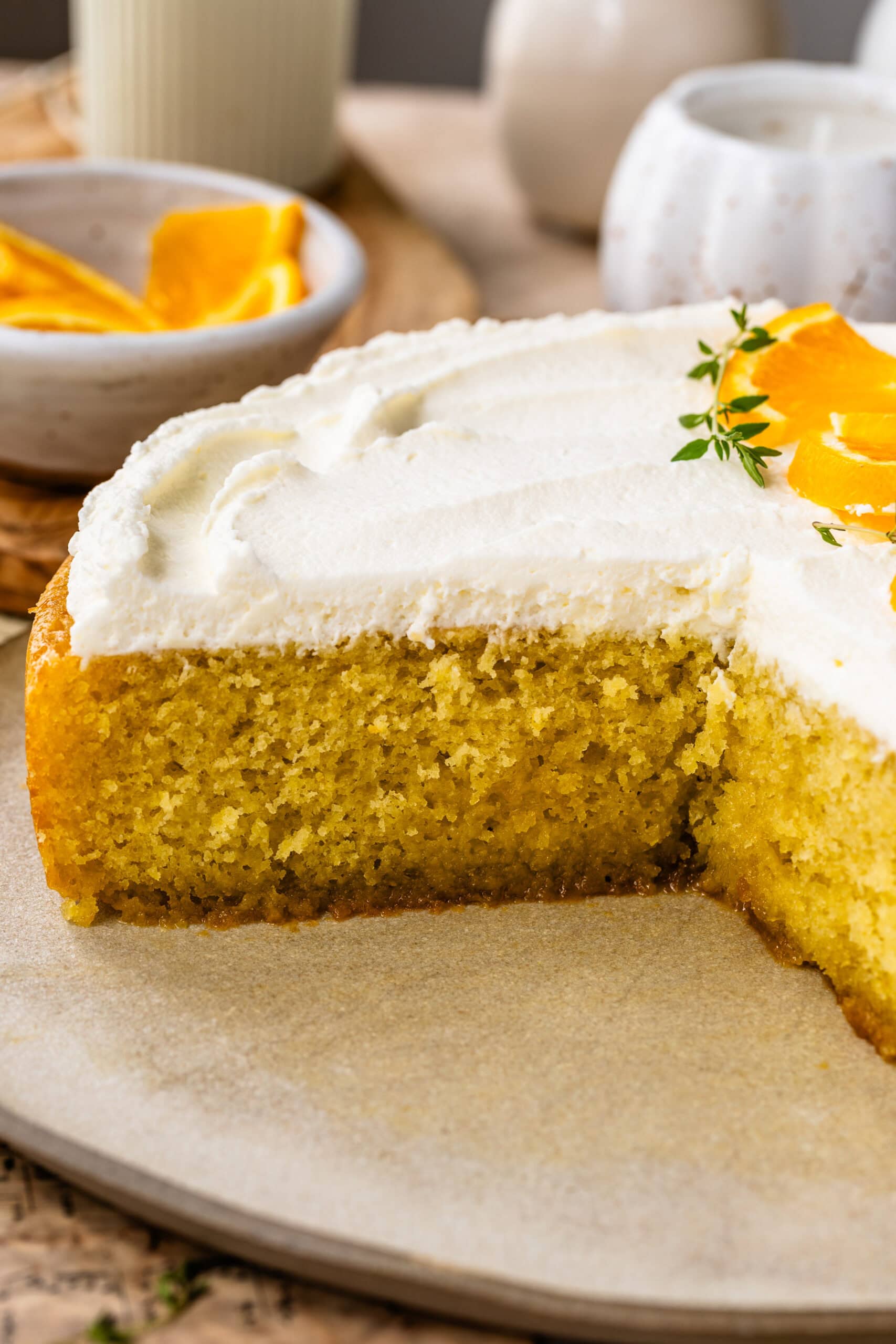 Moist olive oil cake soaked with orange syrup and topped with mascarpone whipped cream.