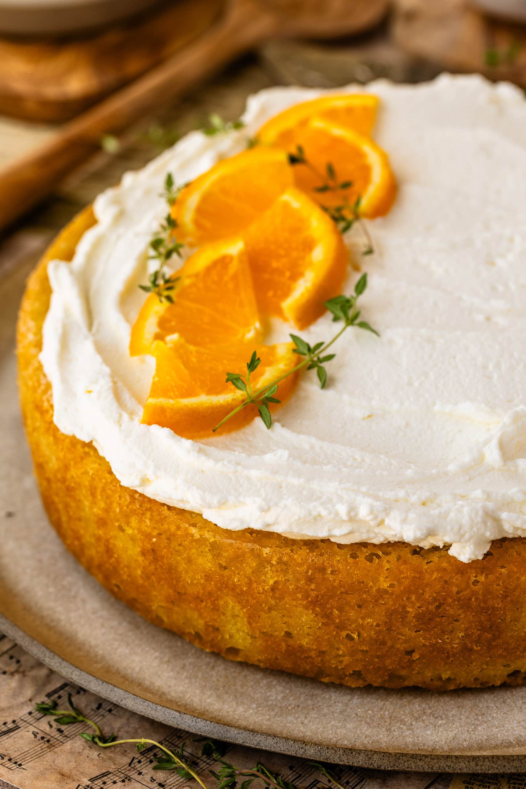 Moist olive oil cake soaked with orange syrup and topped with mascarpone whipped cream.