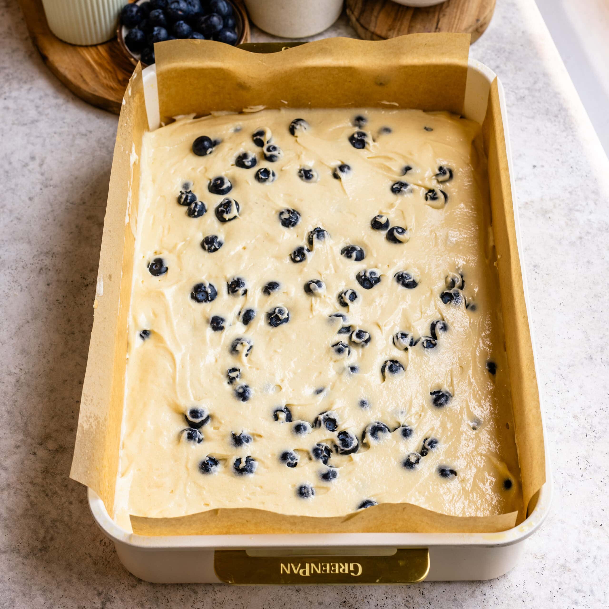 Another layer of blueberries swirled into the cake batter for Blueberry Sheet Cake.
