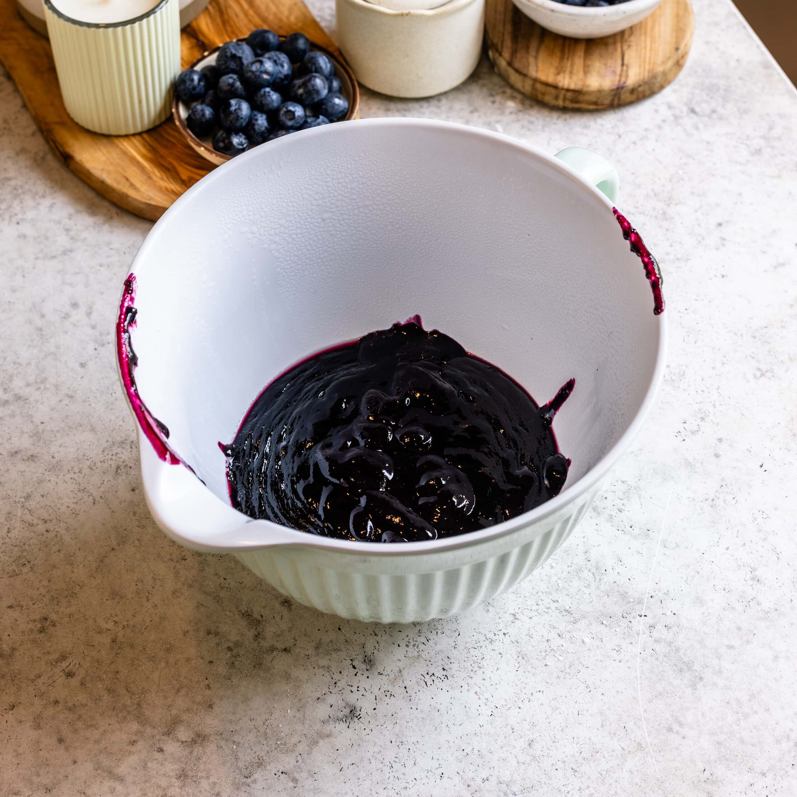 Strained blueberry sauce to achieve a silky consistency.